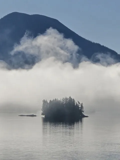 Morning fog lifting off a small island on the BC coast
